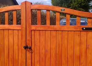 Framed part solid arched top driveway gate